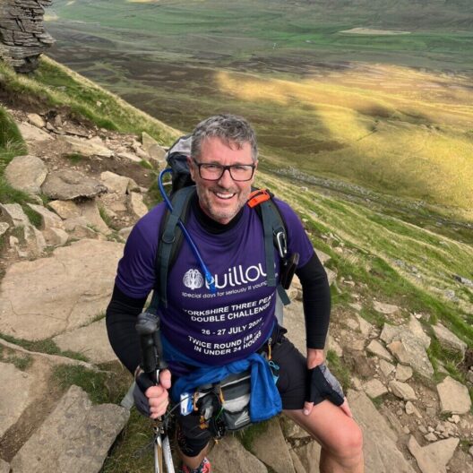 Rob smiiling mid-hike during his double three peaks challenge