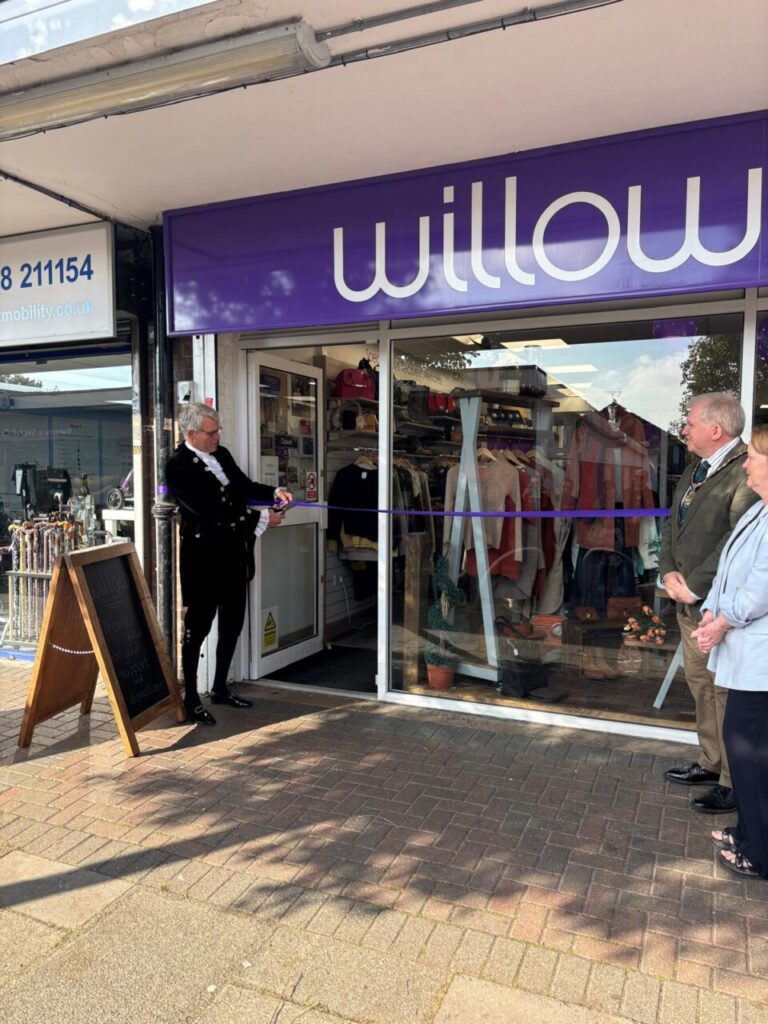High sheriff cuts the ribbon at the Willow Stevenage charity shop grand re-opening after their makeover. 