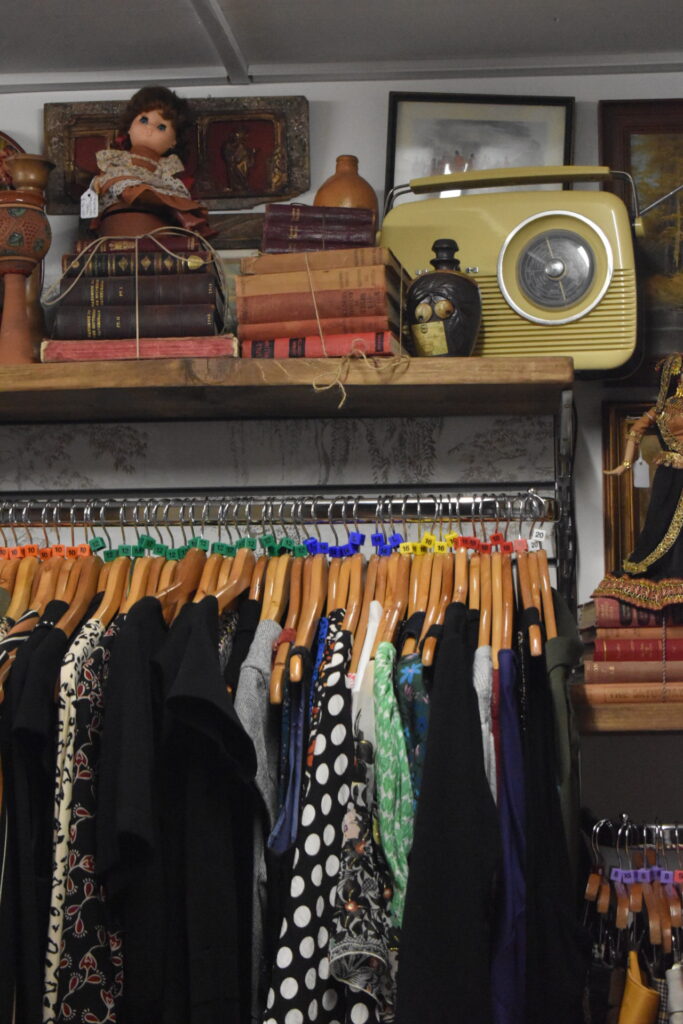 Clothing rail and vintage items for sale inside Willow Biggleswade shop
