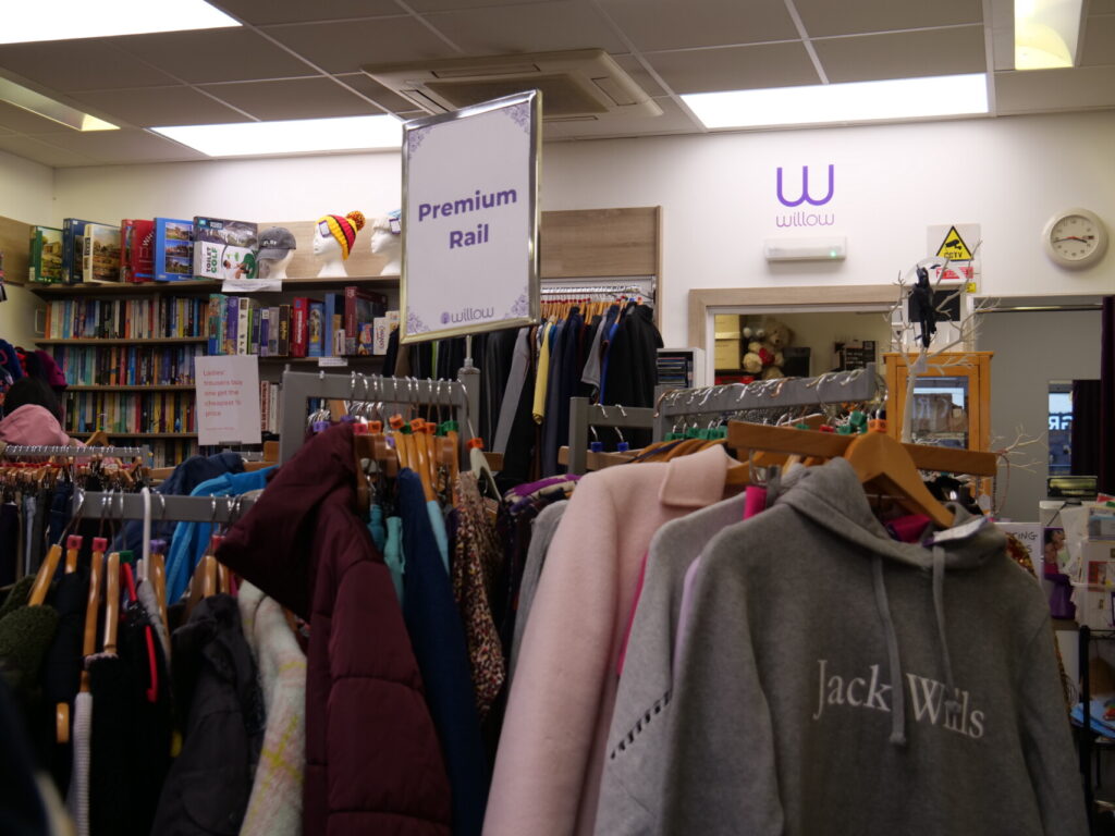 Inside Willow Hemel shop, with "Premium Rail" displaying designer items. 