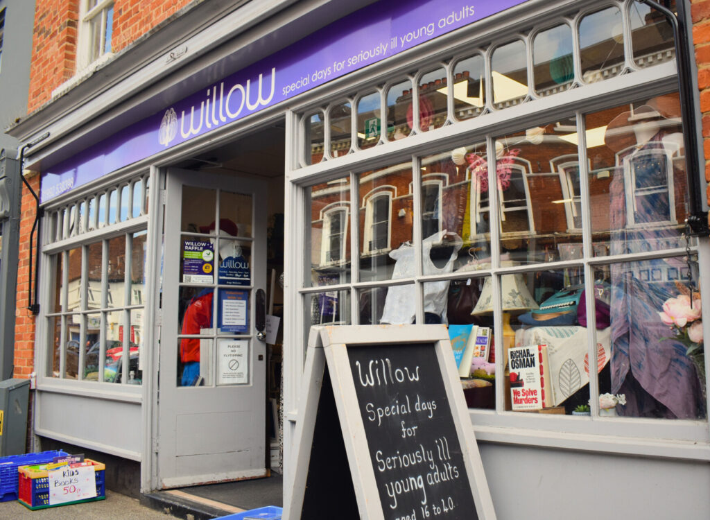 Willow Hertford charity shop front with sign reading "Willow Special days for seriously ill young adults aged 16-40"