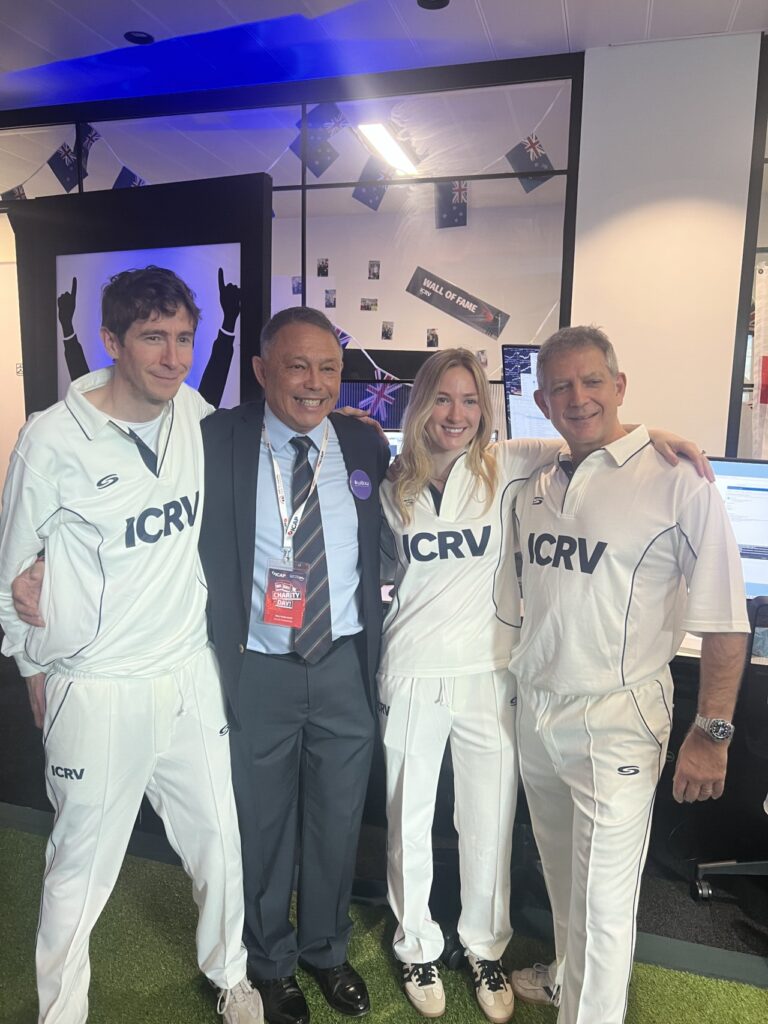 Rory Underwood smiles at ICAP Charity day with corporate teams dressed in Cricket costumes