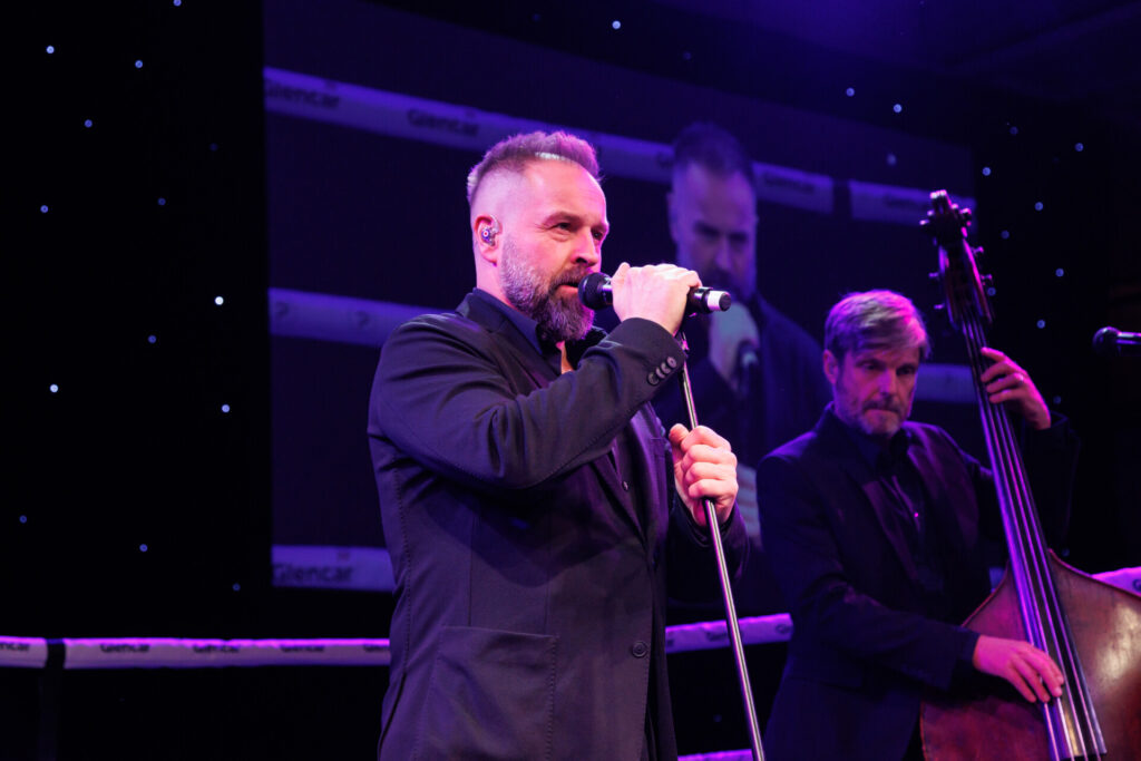 Alfie Boe performing in the ring at A Night to Remember event